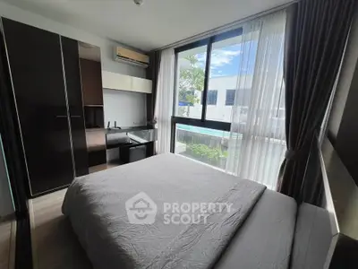 Modern bedroom with large window and pool view in stylish apartment