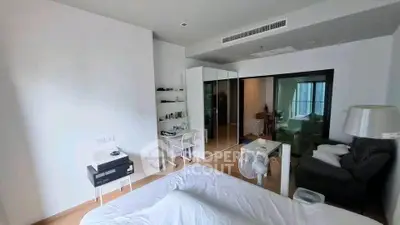 Spacious modern bedroom with sleek design and ample natural light