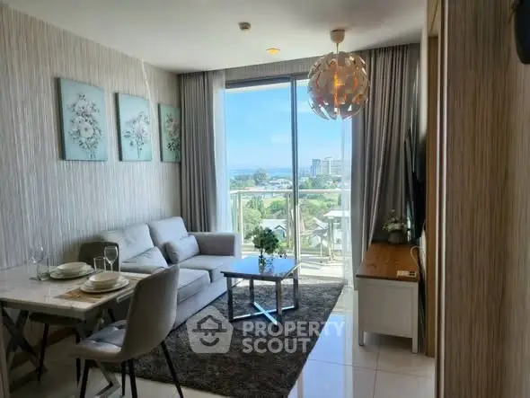 Modern living room with stunning view and elegant decor in a high-rise apartment.