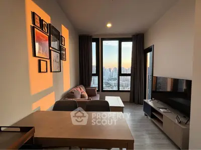 Modern living room with city view, stylish decor, and natural light.