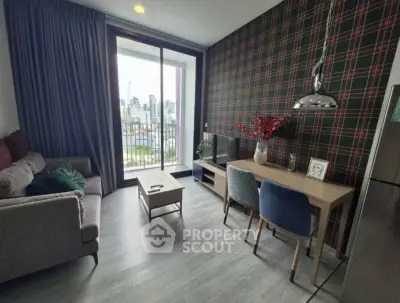 Modern living room with city view, stylish decor, and cozy seating area.