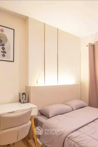 Cozy bedroom with modern decor and soft lighting, featuring a comfortable bed and stylish desk.