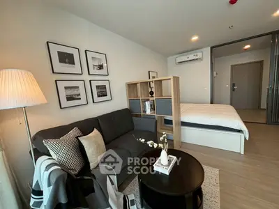 Modern studio apartment with cozy living area and stylish decor