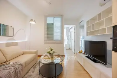 Modern living room with cozy sofa, stylish decor, and sleek TV unit