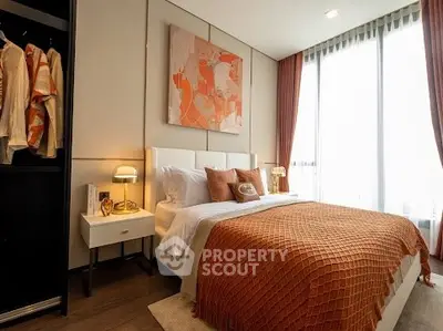 Luxurious bedroom with modern decor and large windows for natural light