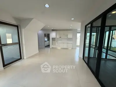 Spacious modern interior with sleek design and large windows for natural light.