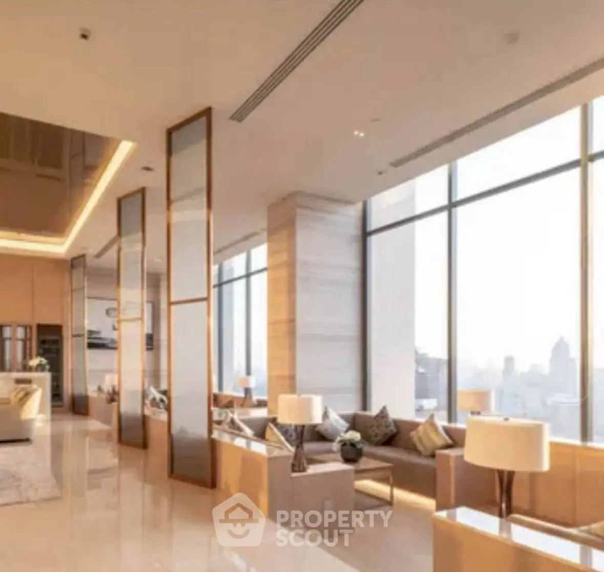 Luxurious modern living room with panoramic city views and elegant decor.