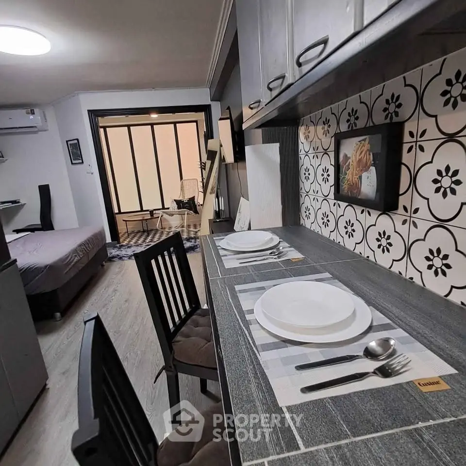 Chic studio apartment with modern kitchen and stylish decor