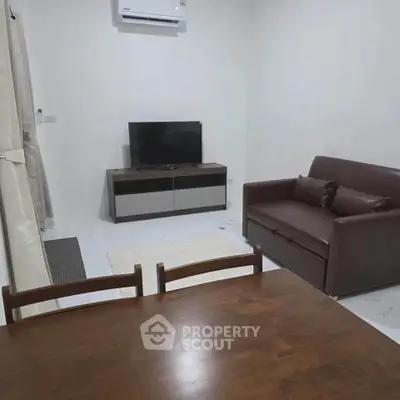 Cozy living room with modern furniture and air conditioning