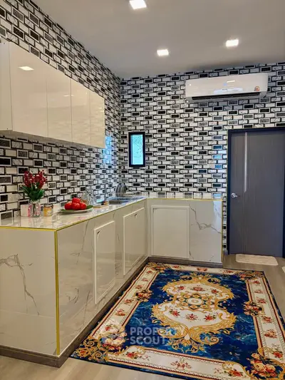 Modern kitchen with marble countertops and stylish brick wall design