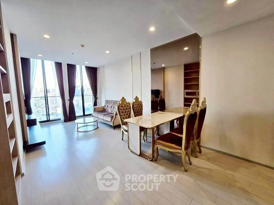 Luxurious living room with elegant furniture and city view, perfect for modern urban living.