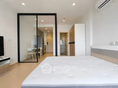 Modern studio apartment with open layout and sleek furnishings