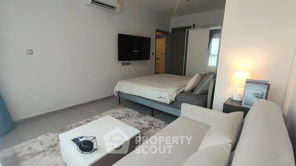 Modern studio apartment with cozy living area and stylish decor