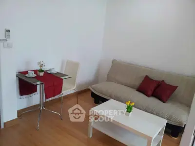 Cozy living room with modern decor and small dining area