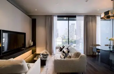 Luxurious modern living room with city view, elegant decor, and ample natural light.
