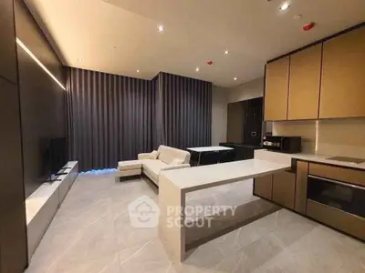 Modern open-layout living room with sleek kitchen and stylish furniture