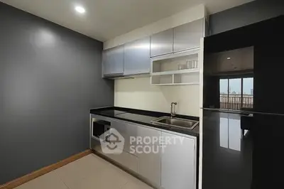 Modern kitchen with sleek cabinetry and open layout design