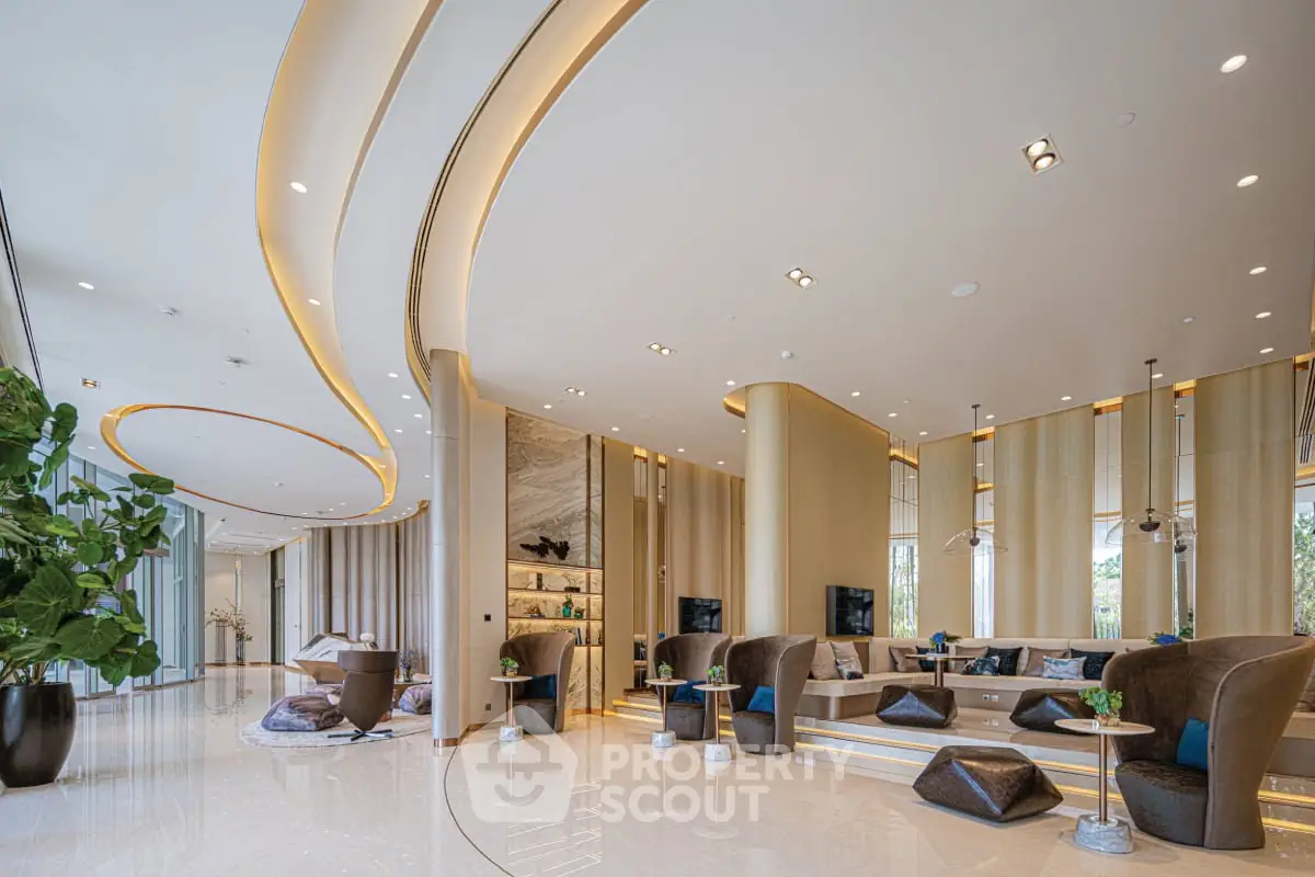 Luxurious modern living room with elegant curved design and plush seating
