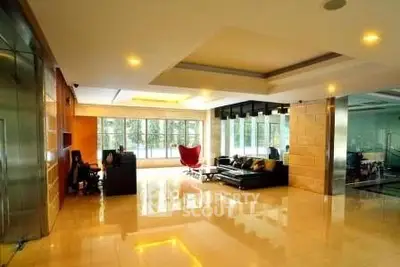 Spacious modern living room with large windows and stylish furniture
