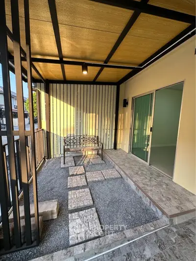 Charming outdoor patio with modern design and cozy seating area, perfect for relaxation and entertaining.