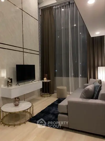 Luxurious modern living room with high ceilings and elegant decor