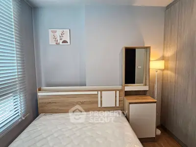 Cozy bedroom with modern wooden furniture and soft lighting, perfect for relaxation.