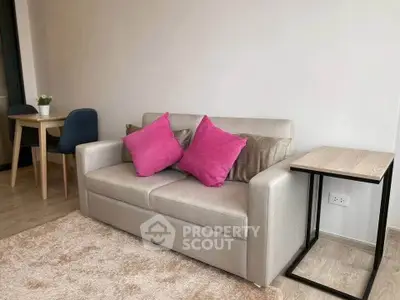 Modern living room with stylish sofa and vibrant decor accents