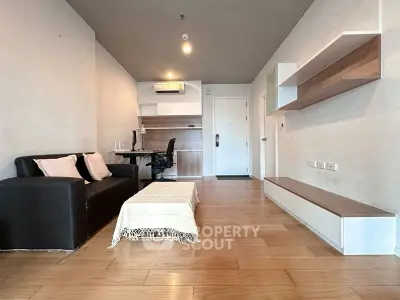 Modern living room with sleek furniture and wooden flooring, perfect for urban living.