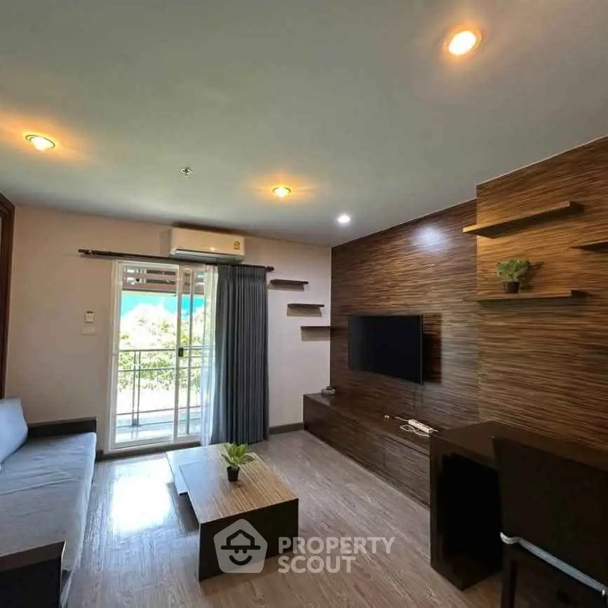Modern living room with wooden accents and balcony view, featuring sleek furniture and ambient lighting.