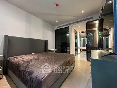Luxurious modern bedroom with plush bedding and sleek design