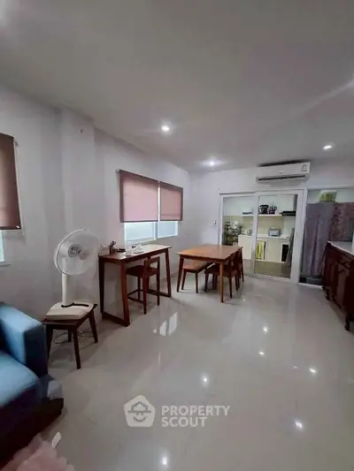 Spacious living area with modern furniture and natural light