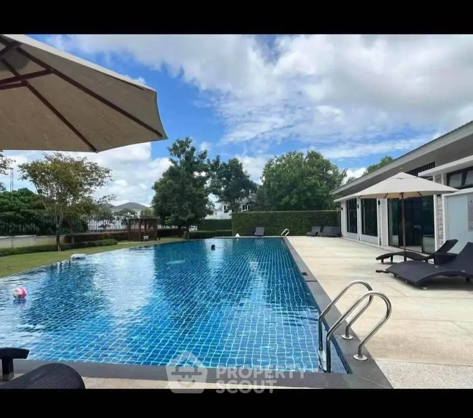 Luxurious outdoor pool area with modern design and relaxing ambiance.
