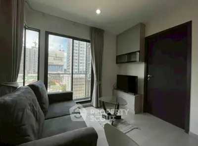 Modern living room with city view and sleek furniture