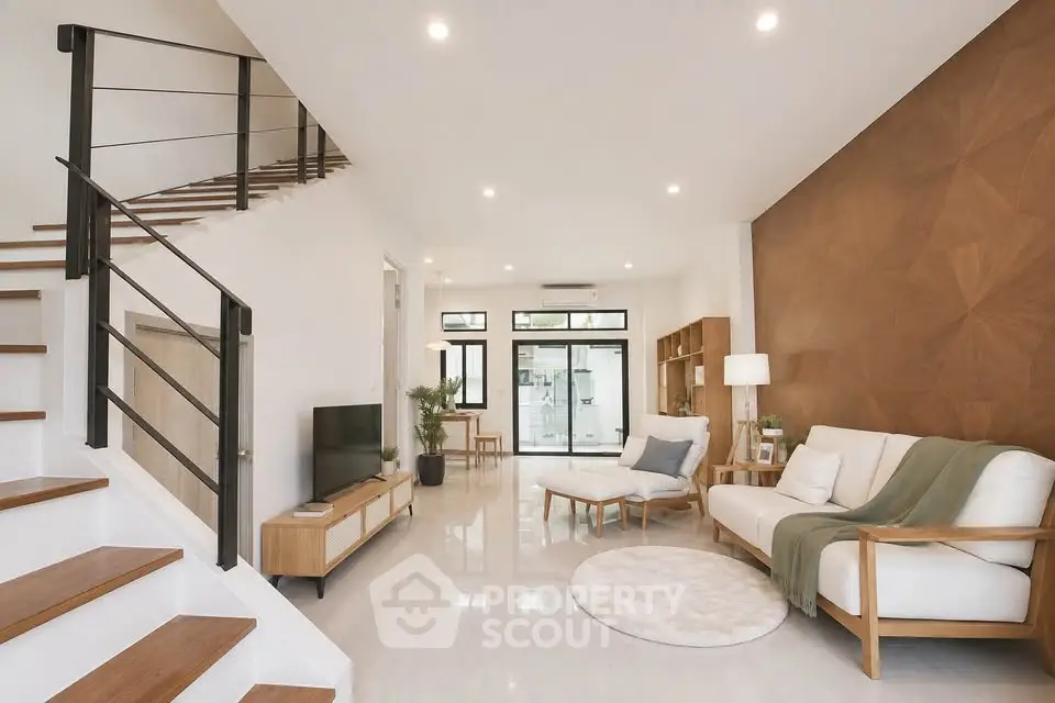 Spacious modern living room with elegant staircase and stylish decor