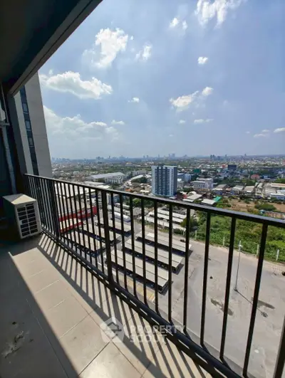 Stunning high-rise balcony with panoramic city views, perfect for urban living.