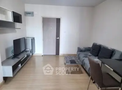 Modern living room with sleek furniture and wooden flooring