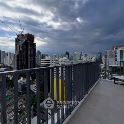 Stunning cityscape view from a modern balcony in a high-rise building, perfect for urban living.
