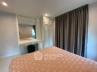 Cozy bedroom with elegant decor and ample natural light