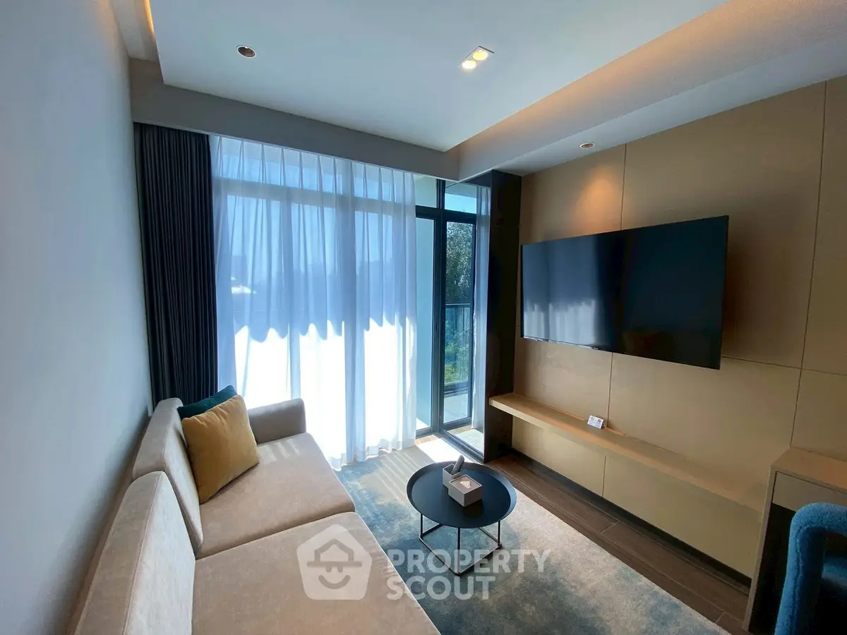 Modern living room with sleek design and large window for natural light