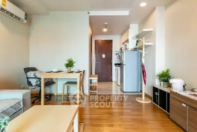 Modern living room with wooden flooring and stylish furniture in a cozy apartment.