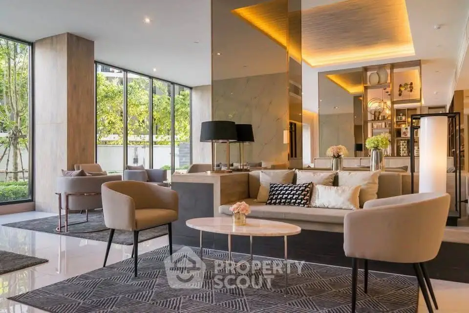 Luxurious modern living room with elegant decor and large windows offering garden views.