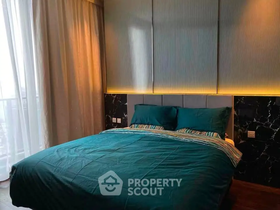 Luxurious bedroom with elegant lighting and stylish decor, perfect for a serene retreat.