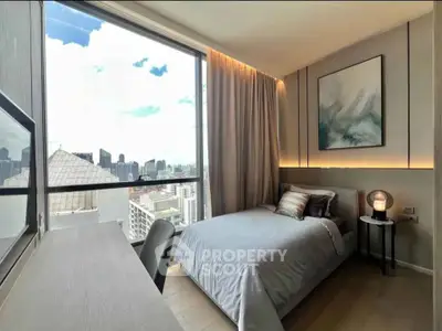 Modern bedroom with stunning city view and elegant decor