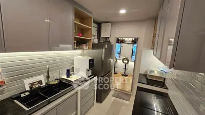 Modern kitchen with sleek cabinets and stainless steel appliances