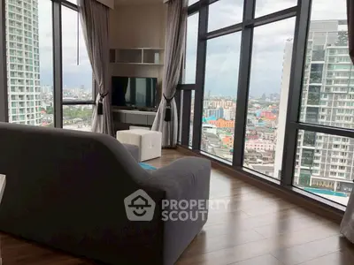 Stunning corner unit with panoramic city views and modern living room design.