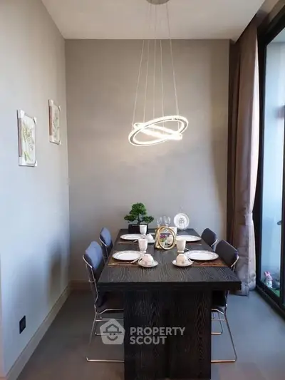 Modern dining area with elegant lighting and stylish decor