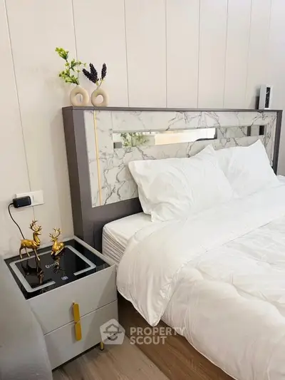 Luxurious bedroom with elegant marble headboard and stylish decor