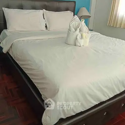 Cozy bedroom with elegant bed and stylish decor, perfect for relaxation.