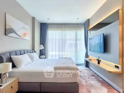 Luxurious modern bedroom with elegant decor and large window for natural light.