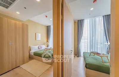 Modern dual-bedroom apartment with stylish decor and natural light